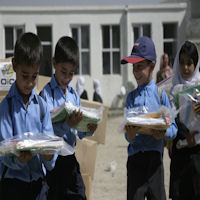 Children receiving their school supplies